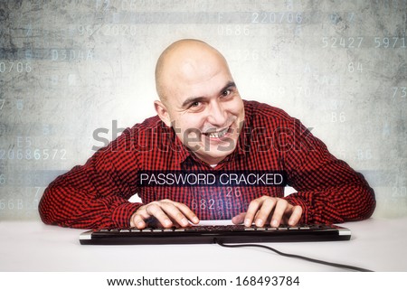 Computer hacker cracked security password. Bald smiling computer hacker typing computer keyboard. Heartbleed bug concept,