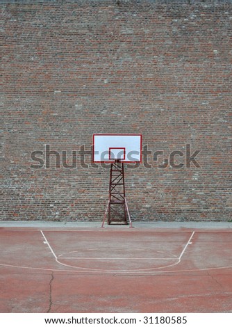 basketball hoop and a cage, red brick wall background.