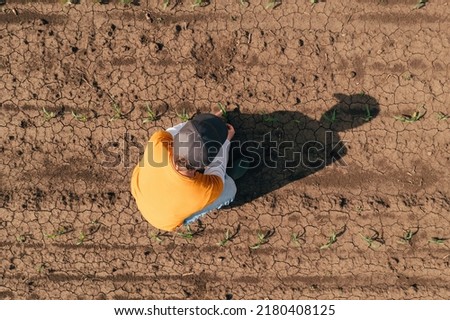 Similar – Image, Stock Photo Aerial view of farmer cleaning dirt of combine in agricultural field