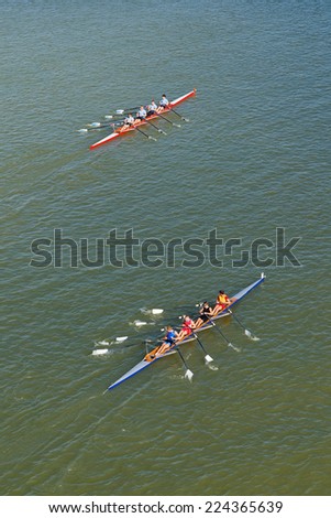 NOVI SAD, SERBIA - OCTOBER 18, 2014: Men rowing on Danube River in Novi Sad on traditional remote regatta competition.