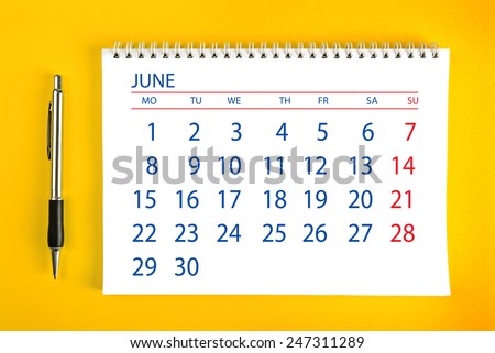 June Paper Calendar Page with Spiral Binding as Time Management and Schedule Concept, top view