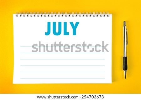 July Paper Calendar Blank Page with Spiral Binding as Time Management and Schedule Concept, top view