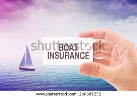 Boat Insurance Agent Holding Business Card, Sailing Boat on Open Sea in Background.