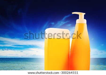 Blank Suntan Lotion Bottles on Sunny Seaside Beach