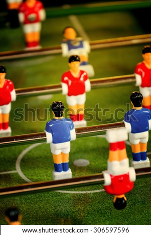 Vintage Foosball, Blue and Red Players Team in Table Soccer or Football Kicker Game, Selective Focus, Retro Tone Effect