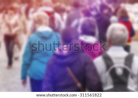 Blurred Crowd of People On Street as General Public Concept with Unrecognizable Crowded Group out of Focus, Vintage Toned Image.