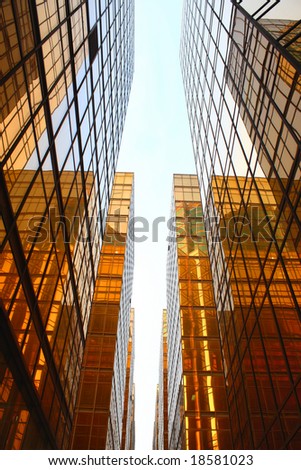 Perspective view of a golden glass building.