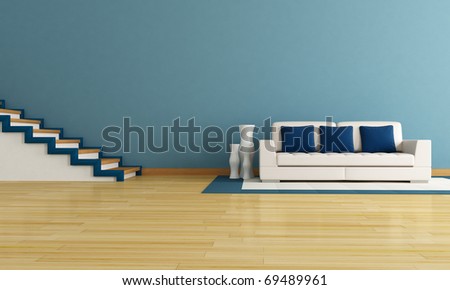 blue living room with staircase and modern white couch