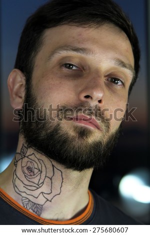 Bearded hipster handsome tattooed man