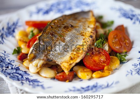 Sea bass with butter bean and tomato salad