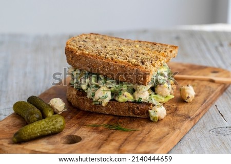 Creamy chickpea salad with avocado, dill, onion and mustard sauce on home made bread Stockfoto © 
