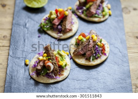 Beef steak tortillas with avocado, sweet corn and tomato salsa