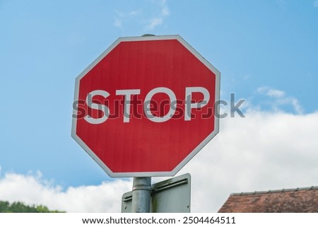Similar – Image, Stock Photo Stop. Indicates the sign. In addition, below it : Continue driving only on the instructions of the control post.
