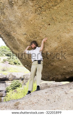 Man who holds the big round stone, like Atlas, ancient greek god