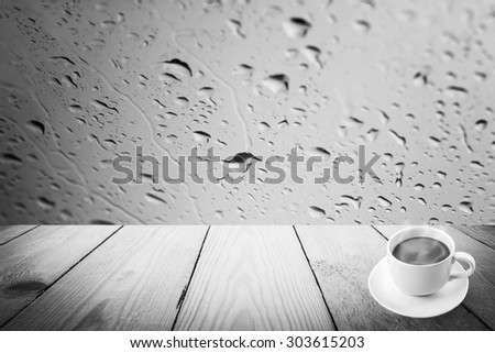 Abstract black and white rain drops on a window or water drops on grass and wood background