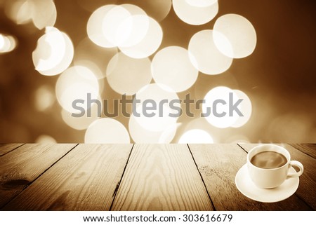 Vintage style - Abstract Black and White bokeh of light and coffee cup and wood background