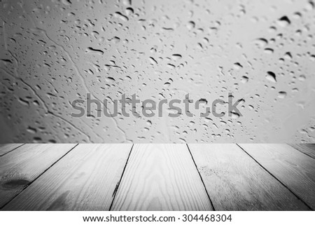 Abstract Black and White rain drops on a window or water drops on grass and wood background