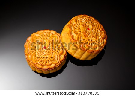 Moon cakes for the chinese Mid-Autumn festival on black background