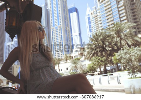 fashion street shooting in United Arabic Emirates in Dubai Marina. yacht club. skyscrapers. summer and luxury around