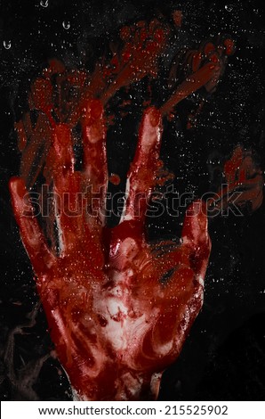 The bloody hand on the wet glass, the bloody window, an imprint of bloody hands, zombie, demon, killer, horror