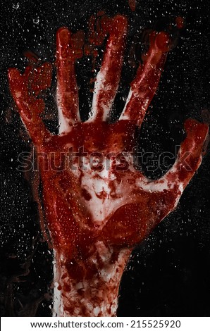 The bloody hand on the wet glass, the bloody window, an imprint of bloody hands, zombie, demon, killer, horror