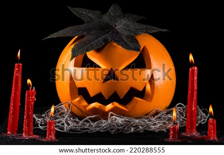 Scary pumpkin, jack lantern, pumpkin halloween, red candles on a black background, halloween theme, pumpkin killer