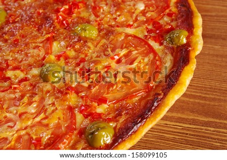 Pizza Marinara with tomatoes and garlic  closeup . farmhouse kitchen