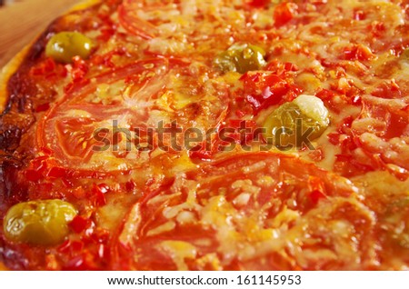 Pizza Marinara with tomatoes and garlic  closeup . farmhouse kitchen