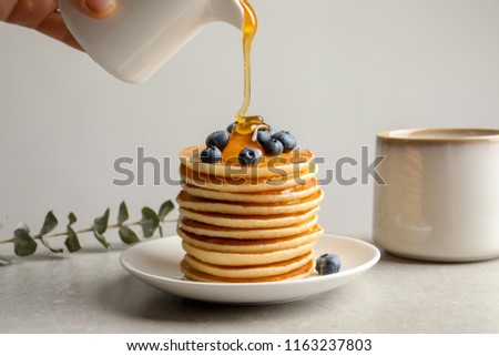 Similar – Image, Stock Photo Blueberries and honey on dark background, top view