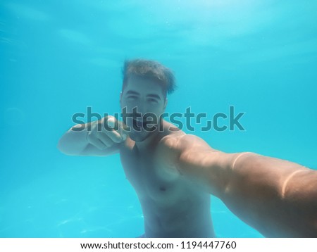 Similar – Image, Stock Photo Underwater view of man free diving in blue ocean.