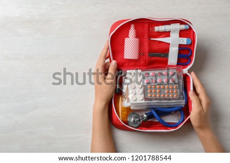 Similar – Image, Stock Photo Woman paining wooden box in blue color with brush