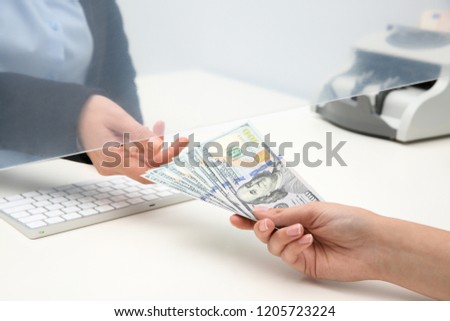 Woman giving money to teller at cash department window, closeup Stock foto © 