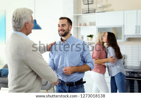 Similar – Image, Stock Photo Husband and daughter visiting senior woman in hospital