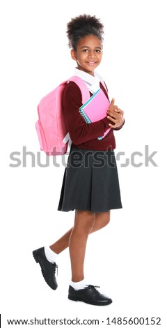 Happy African-American girl in school uniform on white background Imagine de stoc © 