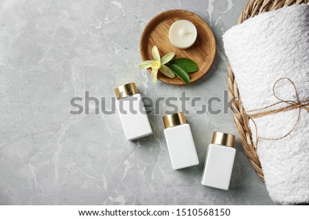 Flat lay composition with cosmetic products on grey stone table, space for text. Spa therapy Stock foto © 