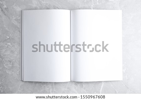 Similar – Image, Stock Photo Opened book-catalog with blank pages on yellow background