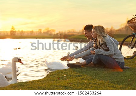 Image, Stock Photo Traveling couple near lake in forest