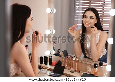 Similar – Image, Stock Photo Young woman in dressing room of swimming pool