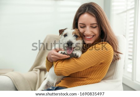 Similar – Image, Stock Photo cute jack russell dog wearing a lion costume on head. Happy dog outdoors in nature in yellow flowers meadow. Sunny spring