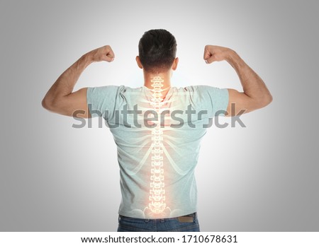Man with healthy back on light background. Spine pain prevention Foto stock © 