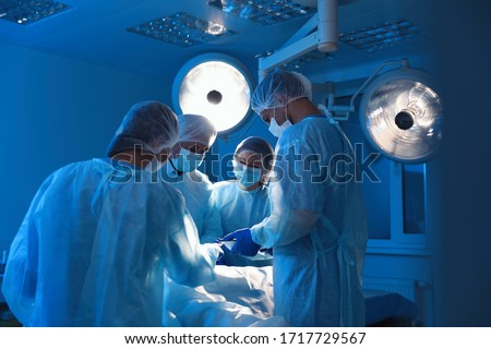 Similar – Image, Stock Photo Female surgeon in operating theater