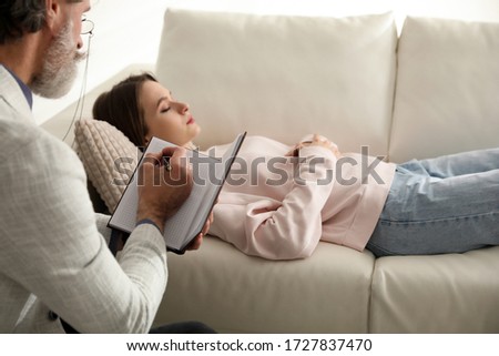 Psychotherapist and patient in office. Hypnotherapy session Stockfoto © 