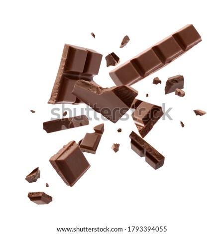 Milk chocolate explosion, pieces shattering on white background Stock fotó © 