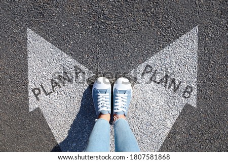 Choosing between Plan A and Plan B. Woman near arrows on road, above view Stock fotó © 
