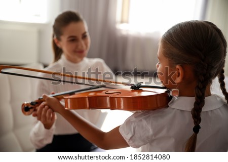 Similar – Image, Stock Photo Girl playing viola Viola