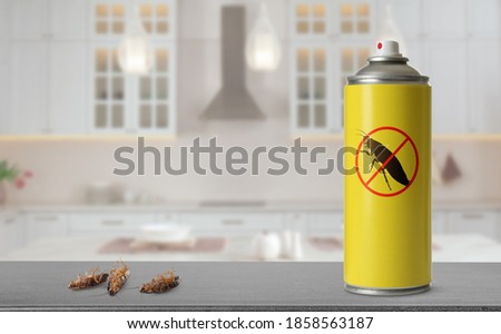 Pest control. Insecticide and dead cockroaches on table in kitchen, space for text ストックフォト © 