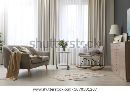Modern living room interior with beautiful curtains on window