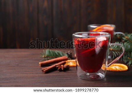Delicious mulled wine on wooden table, space for text Сток-фото © 