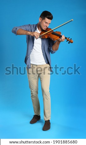 Similar – Image, Stock Photo Man playing violin with face mask