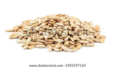 Pile of peeled sunflower seeds isolated on white